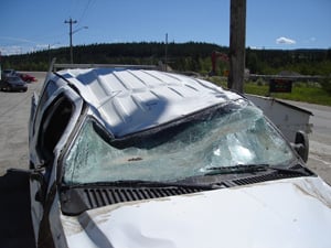 Rollover car with roof crush damage