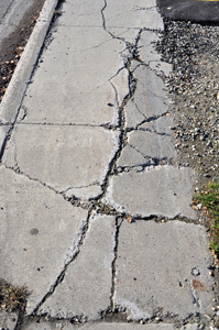 Cracked sidewalk premises liability