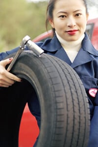 mechanic changing recalled car tire