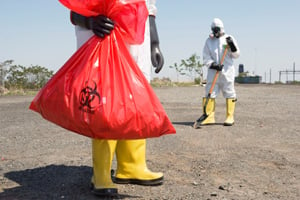 Worker removing toxic waste