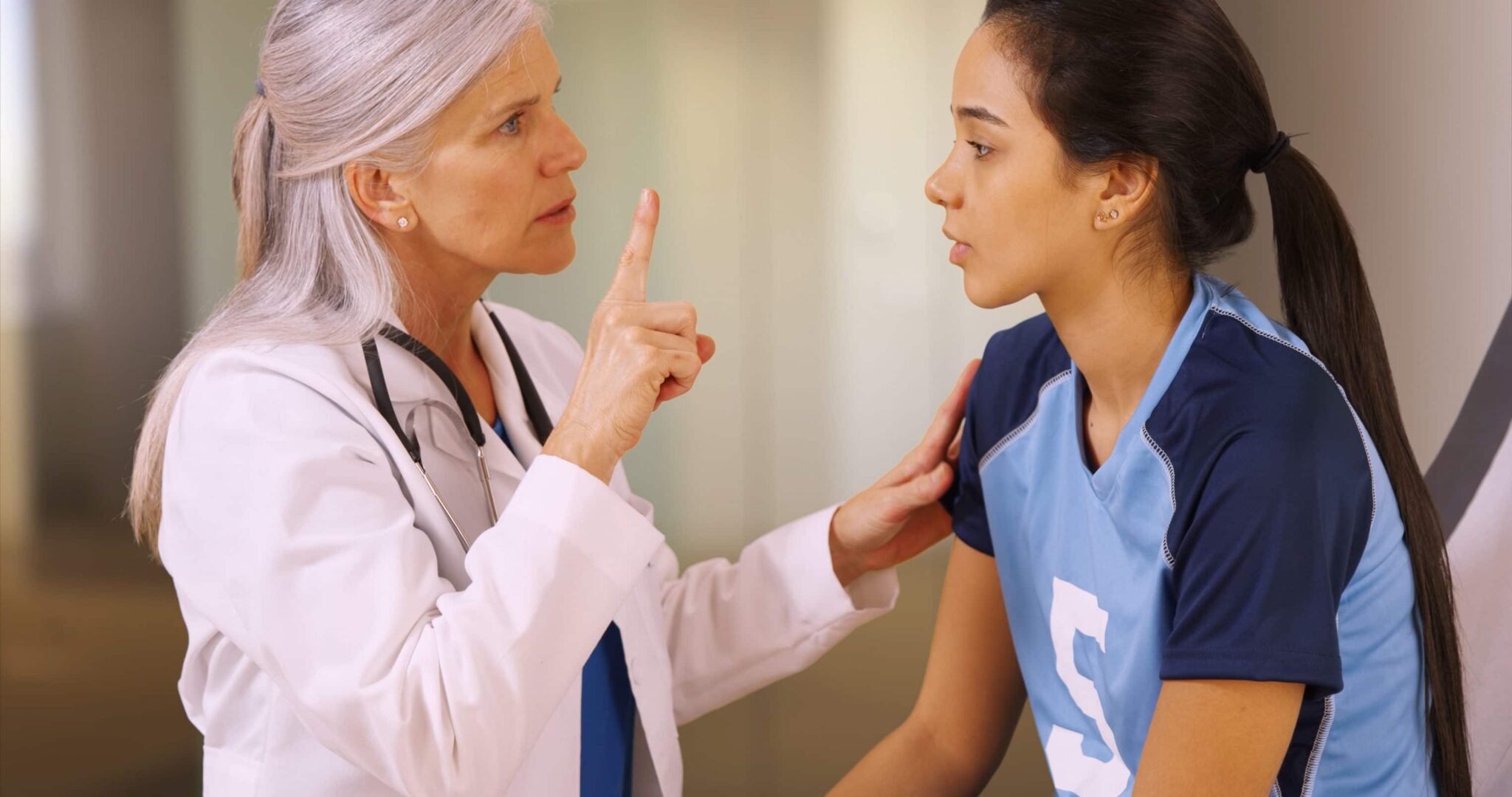 Doctor advising young woman