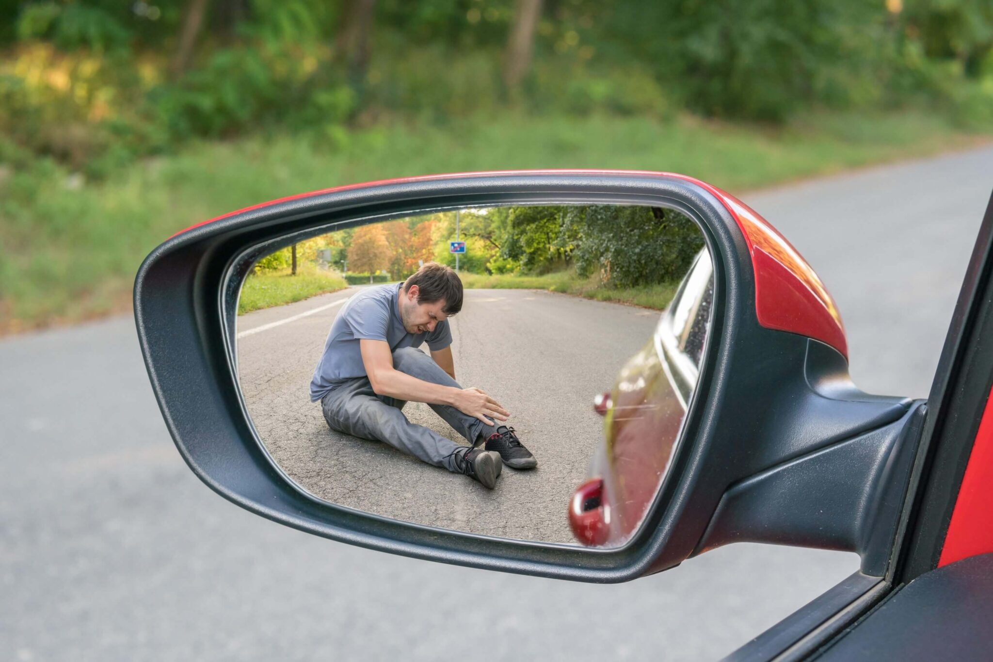 Man shown injured through rear-view window