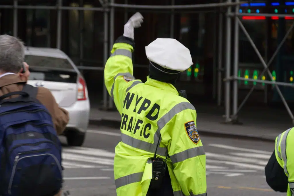 New York Police Department Traffic Enforcement Agent directing traffic at inersection