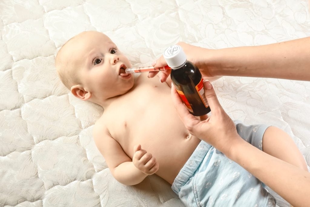 infant receiving liquid ibuprofen orally