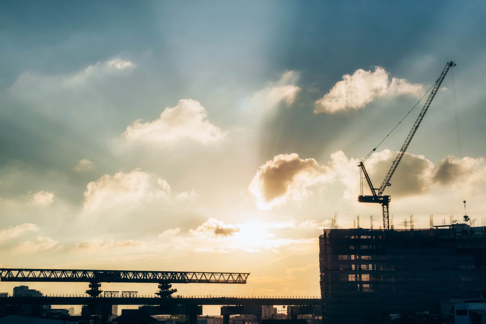 Cranes on construction site and Philadelphia skyline