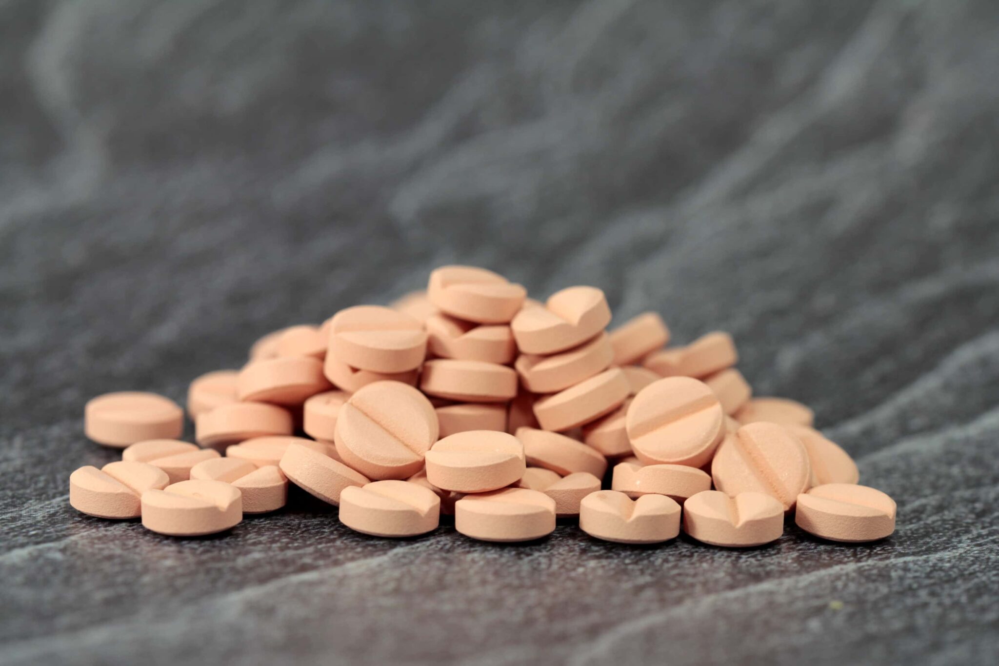 pile of peach-colored pills