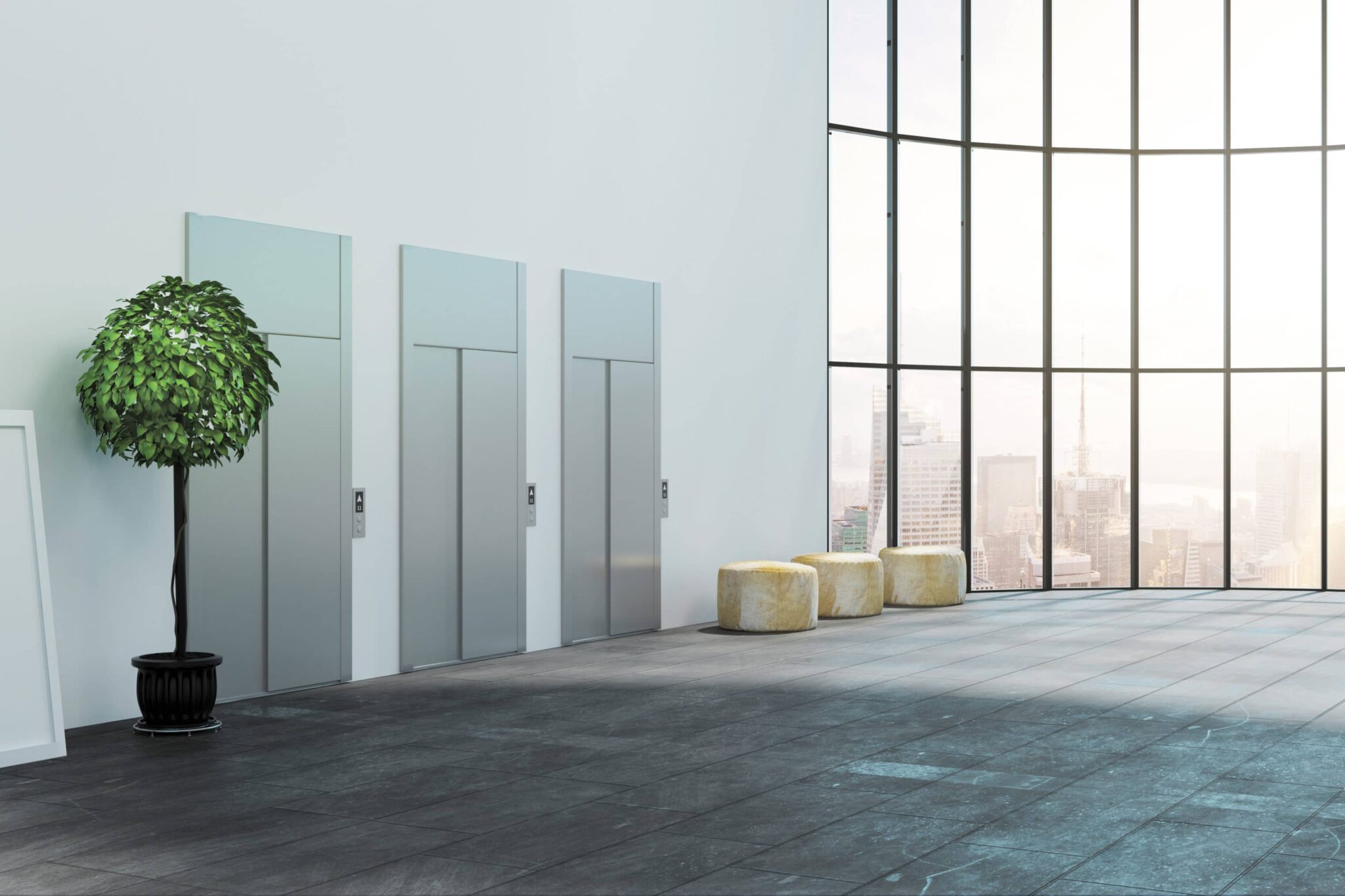 Beige, white and silver New York lobby with elevators and small tree