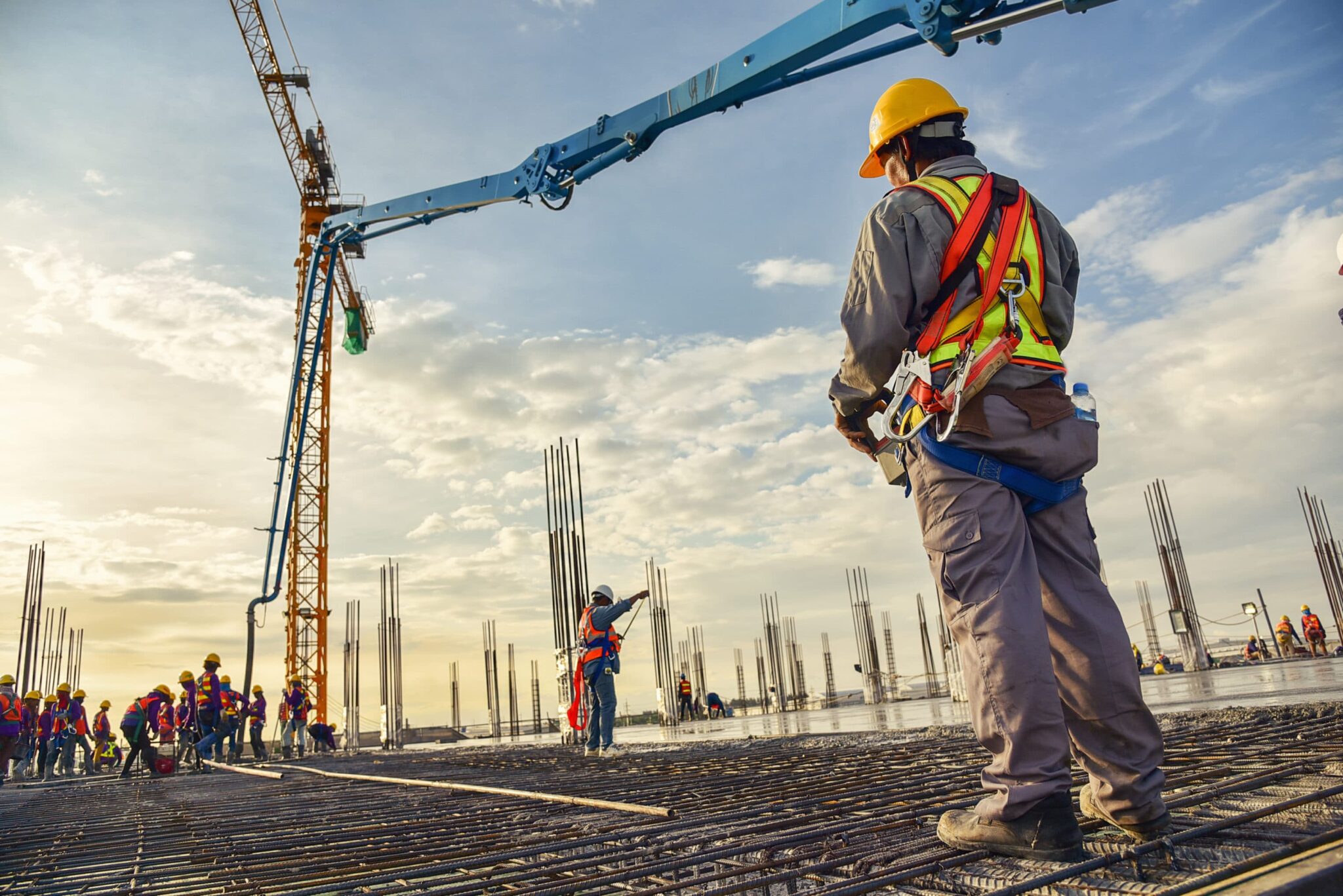 A construction worker is shown on a construction site.