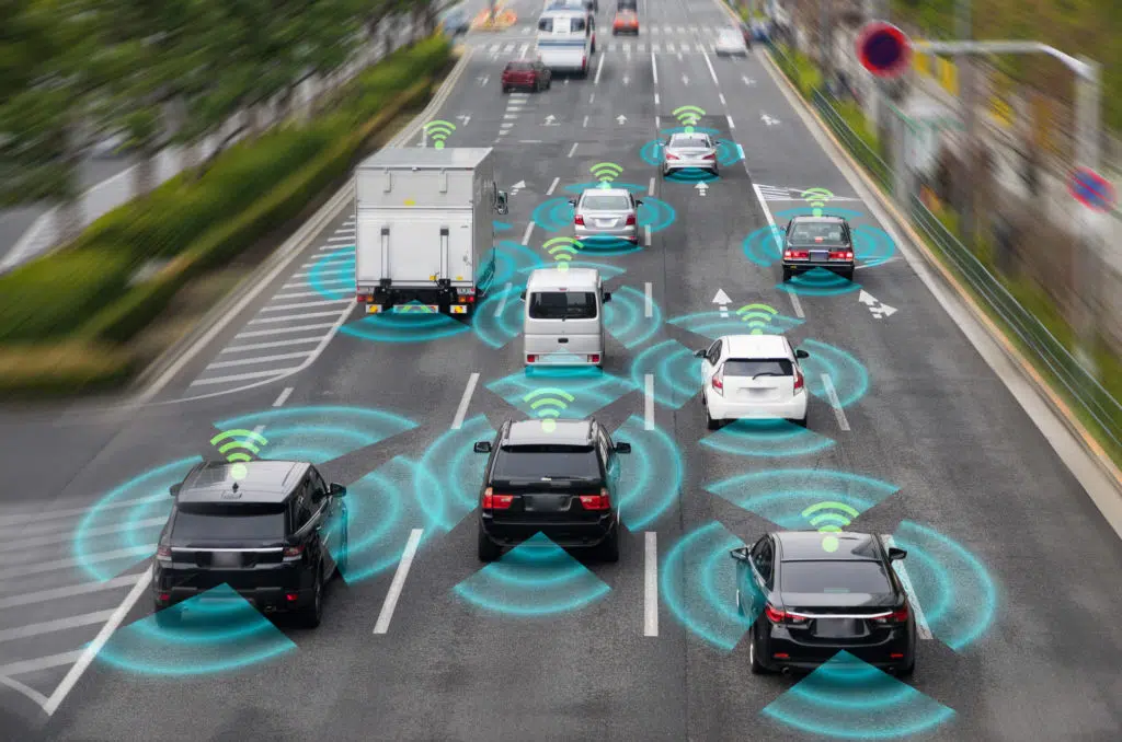 Cars with wireless networks shown on the highway