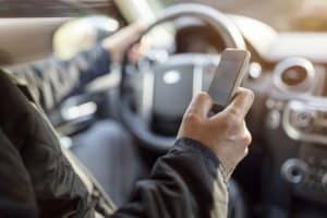 Texting while driving using cell phone in car