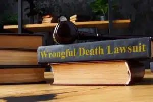 Stack of books with a legal document titled 'Wrongful Death Lawsuit' on top.