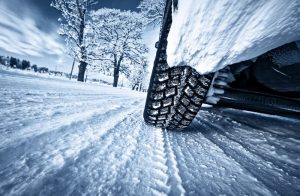 Driving on a treacherous winter road with car tires can be extremely hazardous.