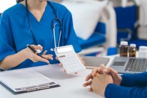 A female doctor giving advice to elderly male patient