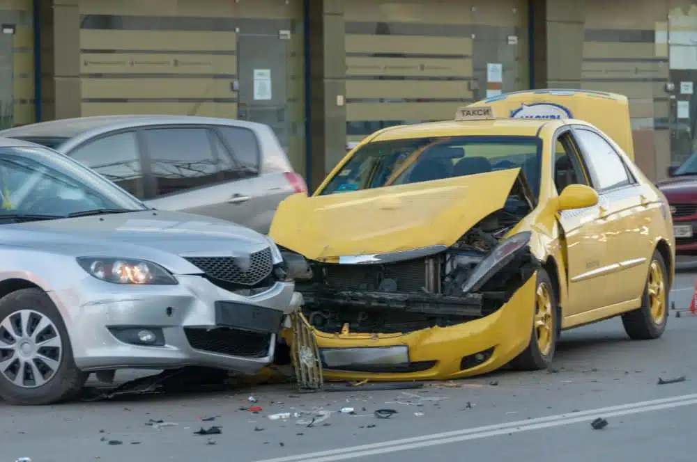 Taxicab collides with a car on the road