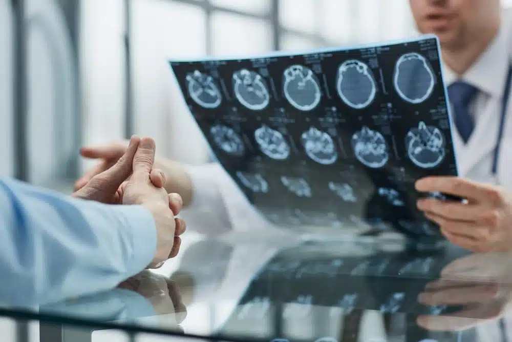 patient at a reception at the doctor looking an x-ray