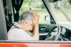 Elderly woman sustained brain injury while driving a car