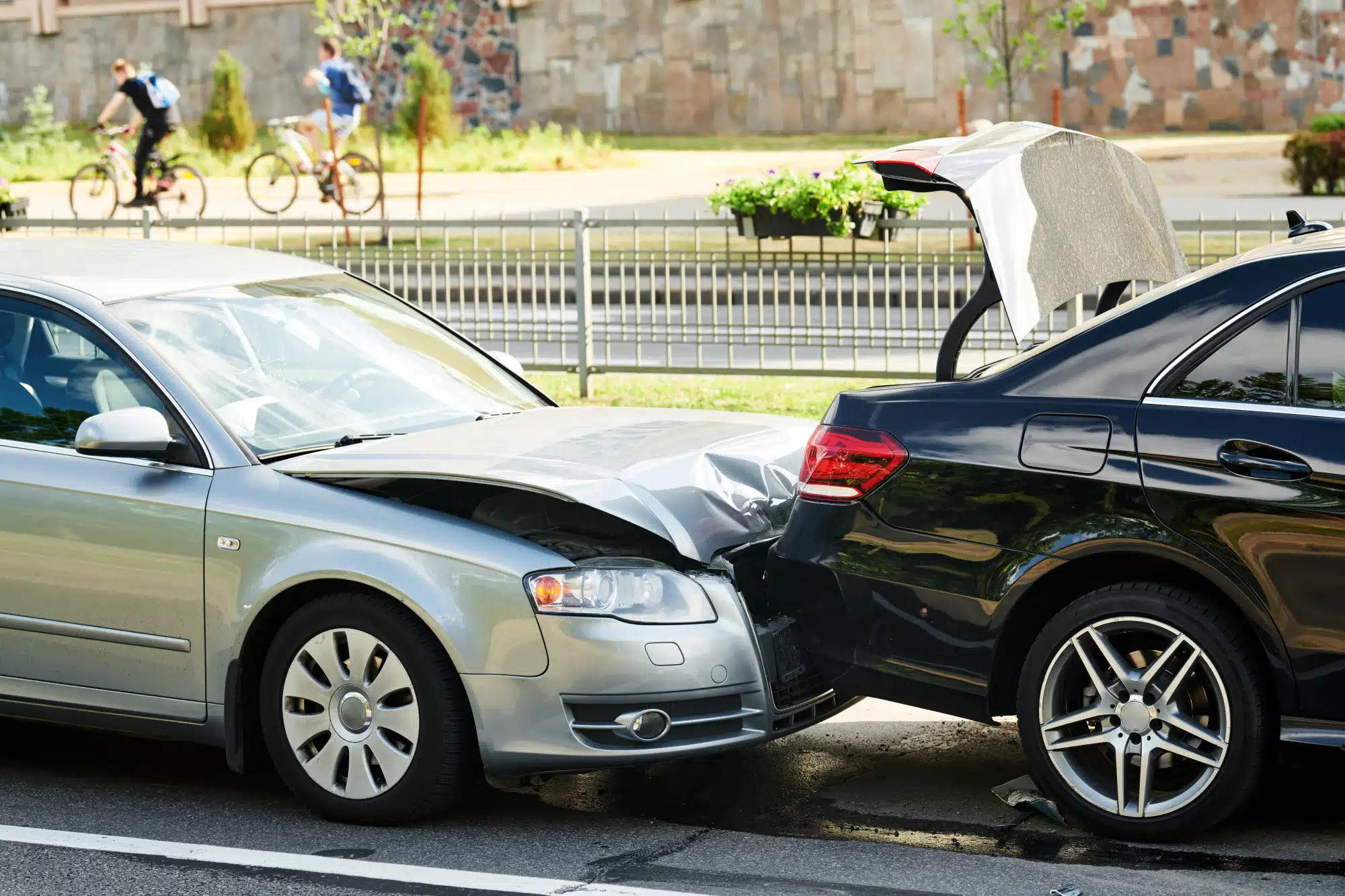 Car collision on city street. car crash accident. Two damaged automobiles