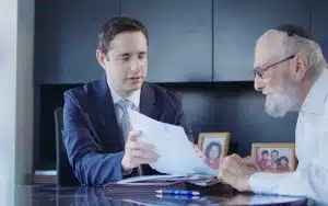 Attorney Adam Drexler with a client