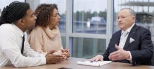 Attorney Allen L. Rothenberg with clients